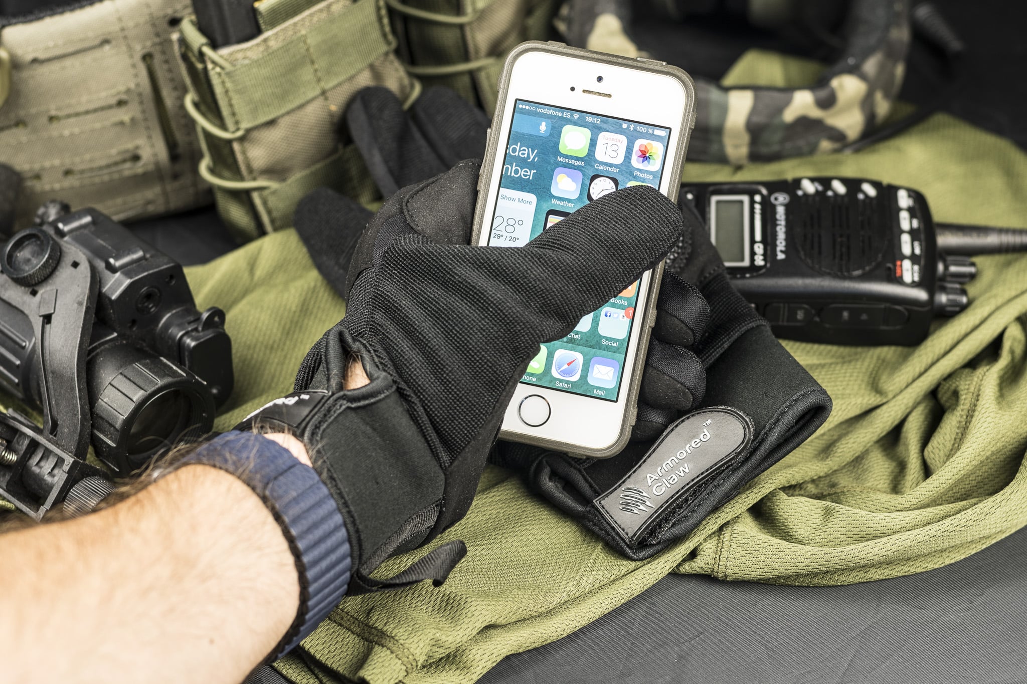 Armored Claw Shield gloves with a smartphone